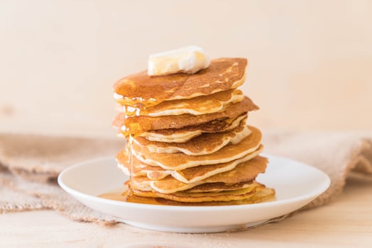 Cheese on pancake stack with honey photo
