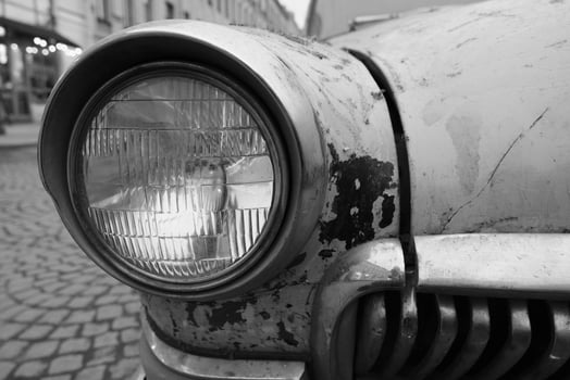 wide low angle view of an old soviet vintage muscle car headlight photo