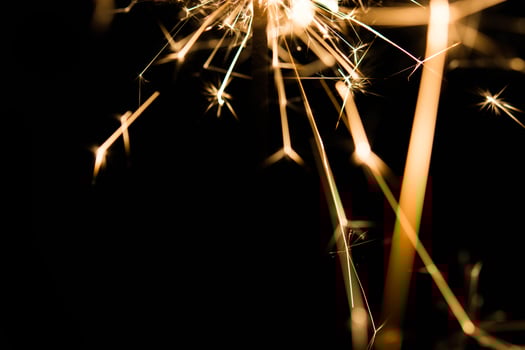 Christmas and newyear party sparkler on black photo