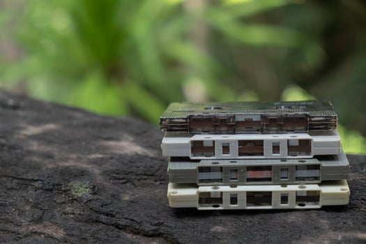 Compact cassette on table background photo