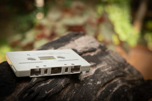 Compact cassette on table background photo