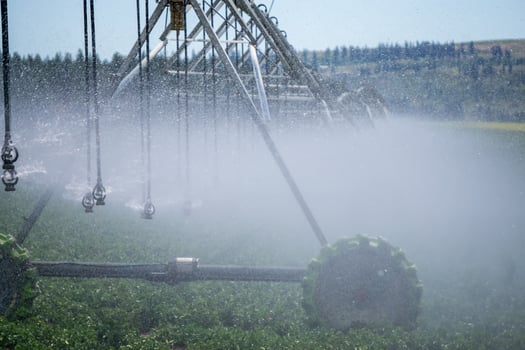 Irrigation equipment on farm field on sunny day photo