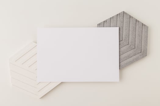 Invitation card mockup, blank greeting card template. Flat lay photo