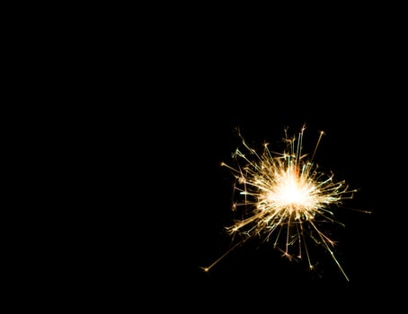 Christmas and newyear party sparkler on black photo
