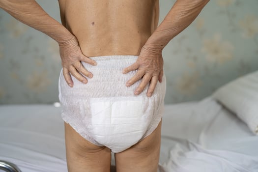 Asian senior or elderly old lady woman patient wearing incontinence diaper in nursing hospital ward, healthy strong medical concept. photo