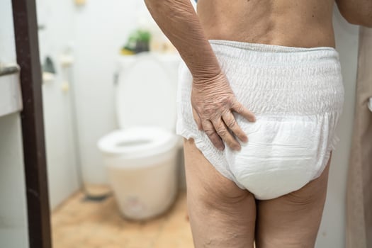 Asian senior or elderly old lady woman patient wearing incontinence diaper in nursing hospital ward, healthy strong medical concept. photo