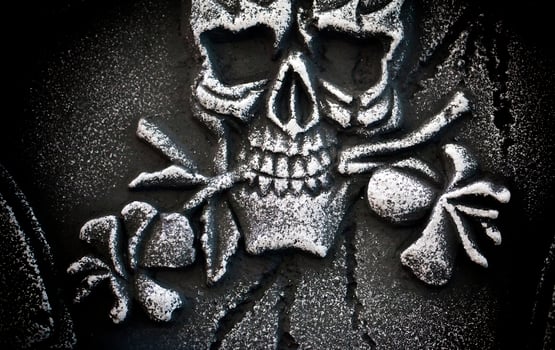 Scary Halloween Symbol Skull on Gravestone photo