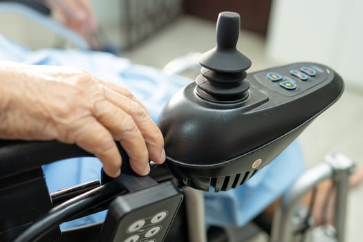 Asian senior woman patient on electric wheelchair at nursing hospital photo