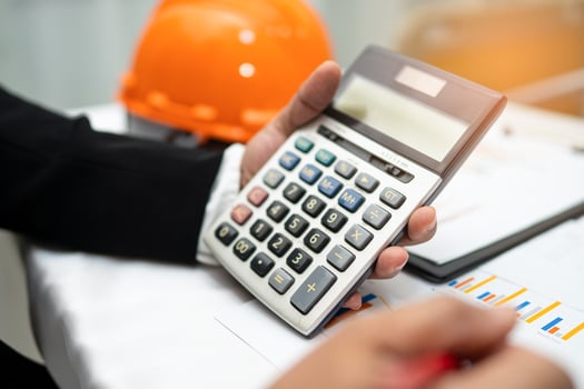 Asian accountant working and analyzing financial reports photo