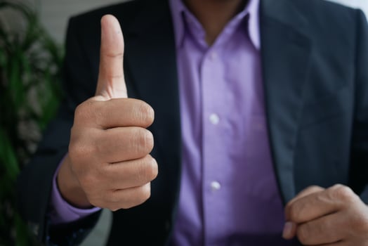 business man hand showing a thumb-up photo