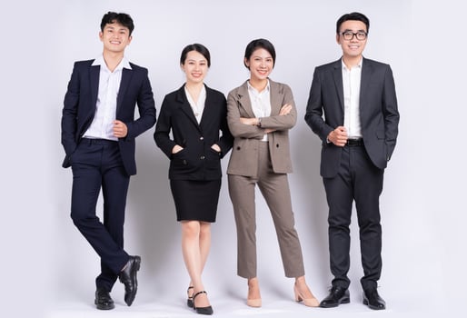 Group of Asian business people posing on a white background photo