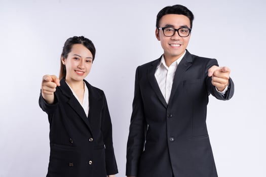 Asian businessman and businesswoman posing on white background photo