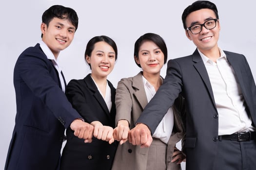 Group of Asian business people posing on a white background photo