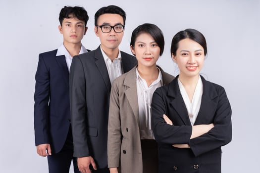 Group of Asian business people posing on a white background photo