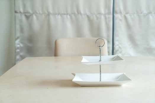 Empty white plate on dining table photo