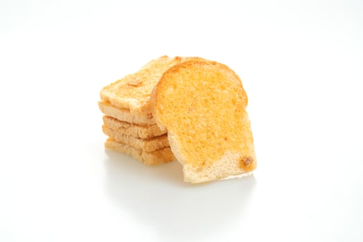 Baked crispy bread with butter and sugar isolated on white background photo