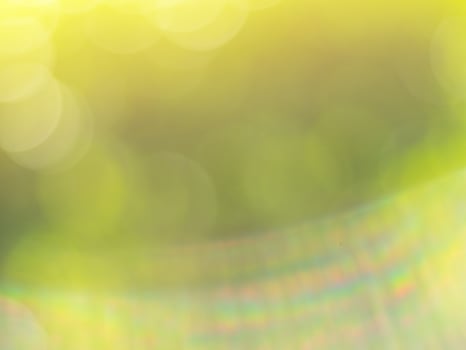 Natural bokeh background in gold sunlight with green and yellow tones photo