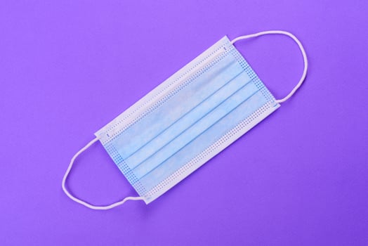 Medical mask on a colored background photo
