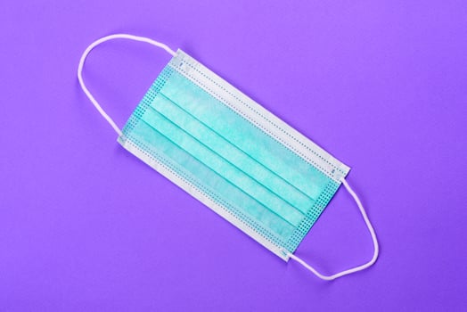 Medical mask on a colored background photo