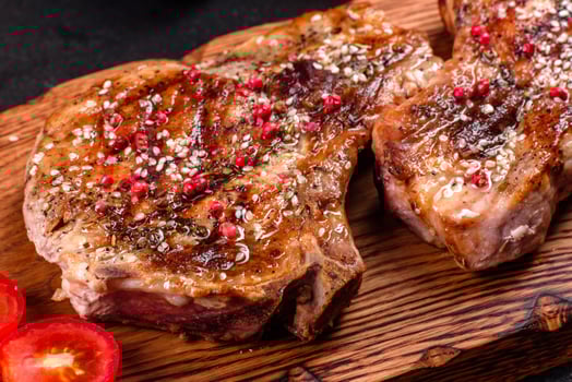 Fresh delicious juicy steak on the bones photo