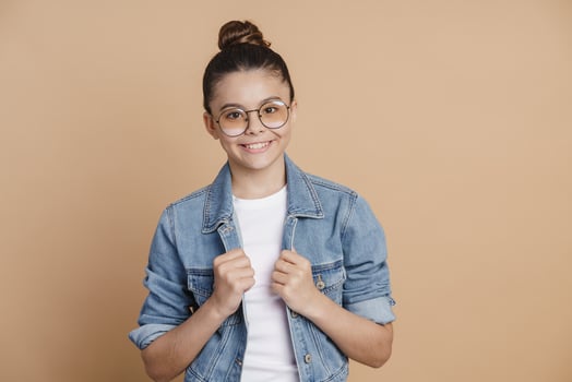 Modern teenage girl dressed in casual style, denim jacket and jeans photo