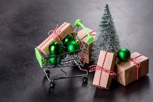 Shopping cart with Christmas gifts and holiday presents photo