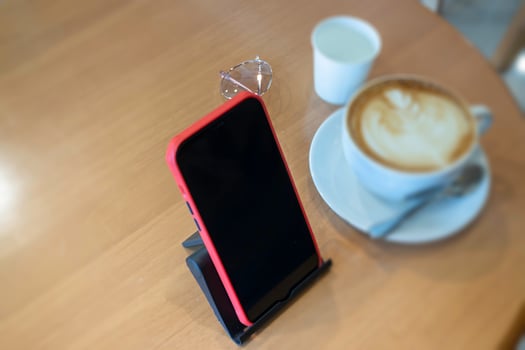 Coffee cup hot latte on wooden table photo