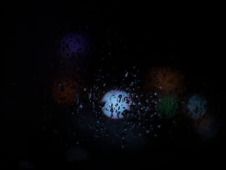 Rain Drop at the night time with the blurred background photo