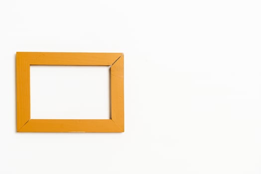 Empty picture frame on white wall background with copy space photo