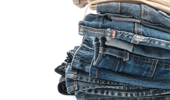 Stacks of clothing on white background photo