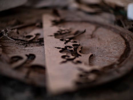 abstract wooden pattern on rusty iron cover on the ground photo