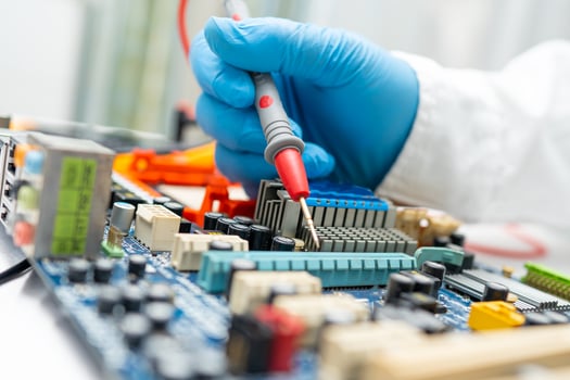 technician repairing inside of hard disk photo