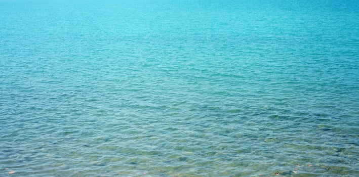 Background from turquoise sea in summer photo