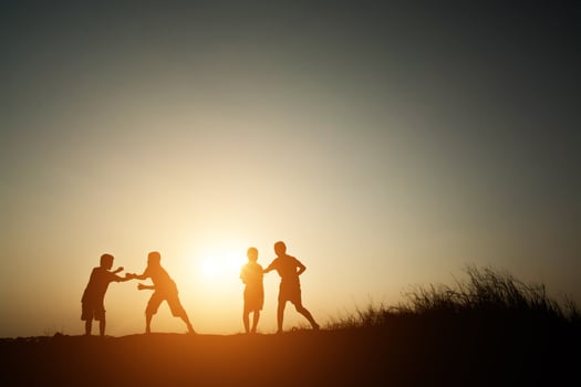 Children playing on summer sunset happy time photo