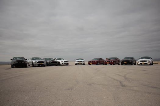 Cars on the race track and on the roads of the desert photo