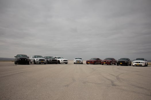 Cars on the race track and on the roads of the desert photo