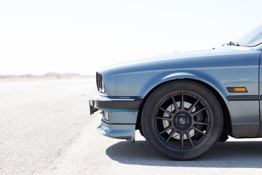 Cars on the race track and on the roads of the desert photo