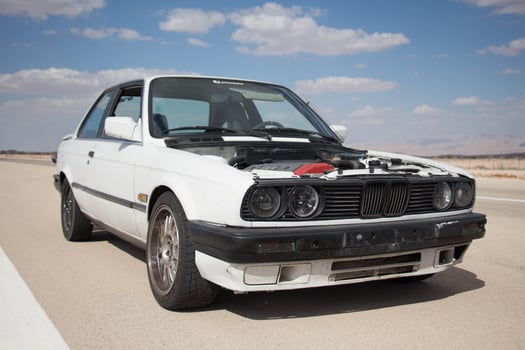 Cars on the race track and on the roads of the desert photo