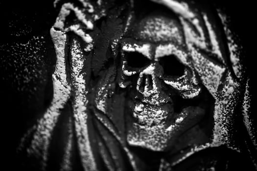 Scary Halloween Symbol Skull on Gravestone photo