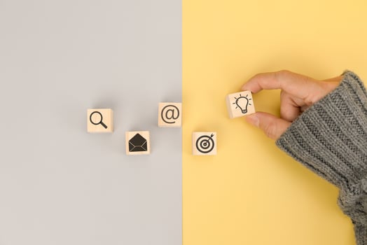 Businessman hand arranging wood block with icon business idea photo