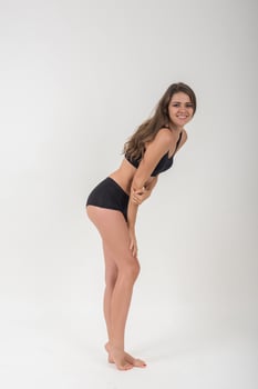 Beautiful woman with healthy body on white background. photo