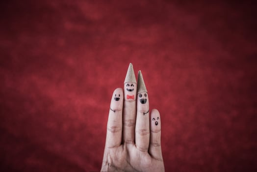 Finger with emotion on red background. photo