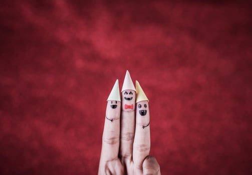 Finger with emotion on red background. photo