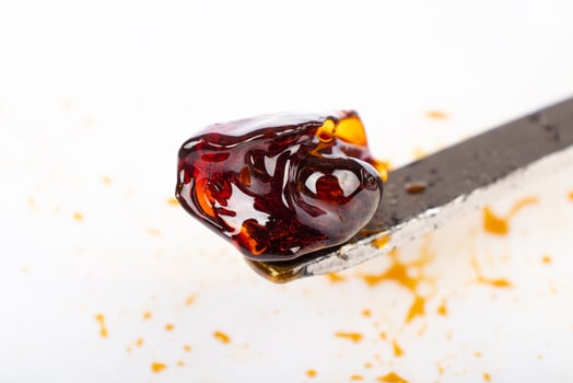 Cannabis concentrate with dab stick, high THC wax. photo
