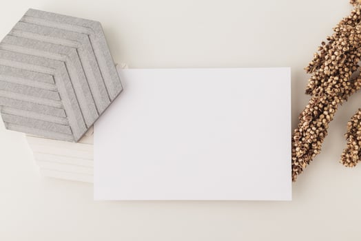 Invitation card mockup, blank greeting card template. Flat lay photo