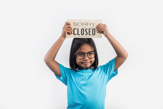 Little girl hand holding wood sign closed photo