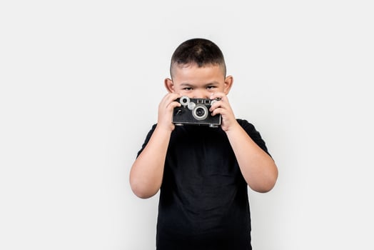 Kid photographer take a photo