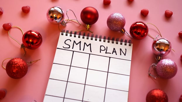 Freelance project. SMM plan blank. White sheet on a pink photo