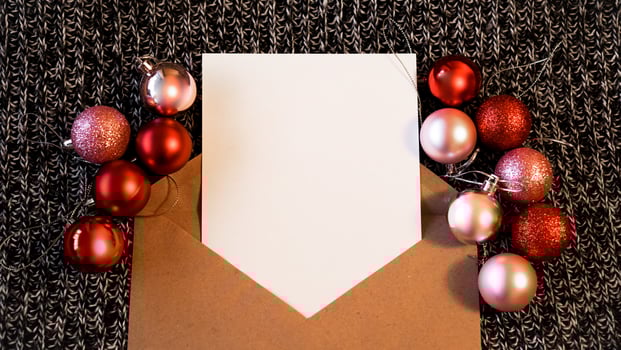 Blank sheet of paper for notes, kraft paper envelope.  New Year photo