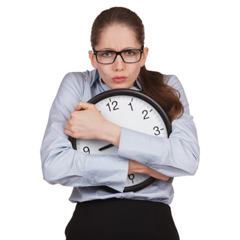 Sad woman with clock in hands photo